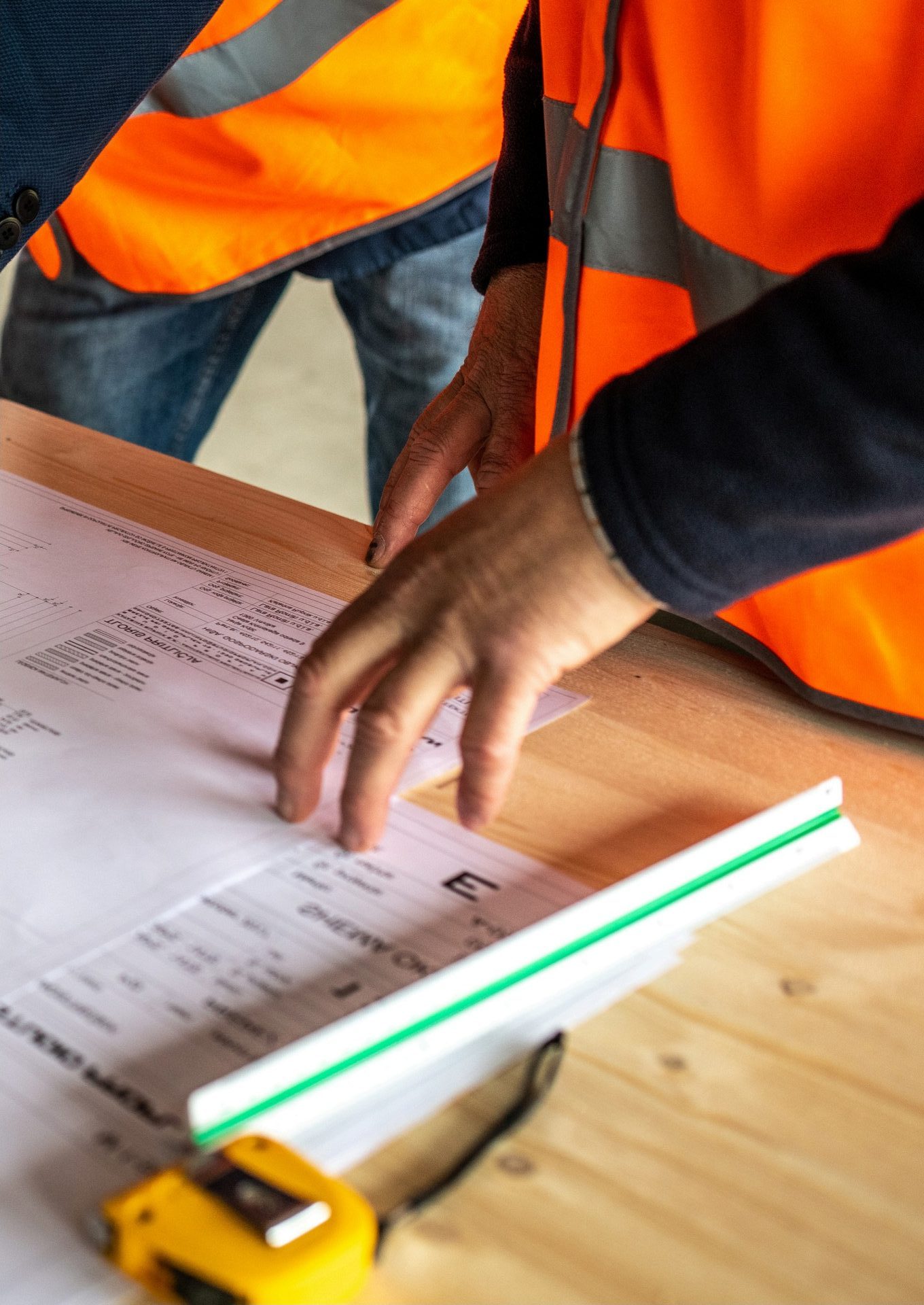 Project team reviewing technical drawings