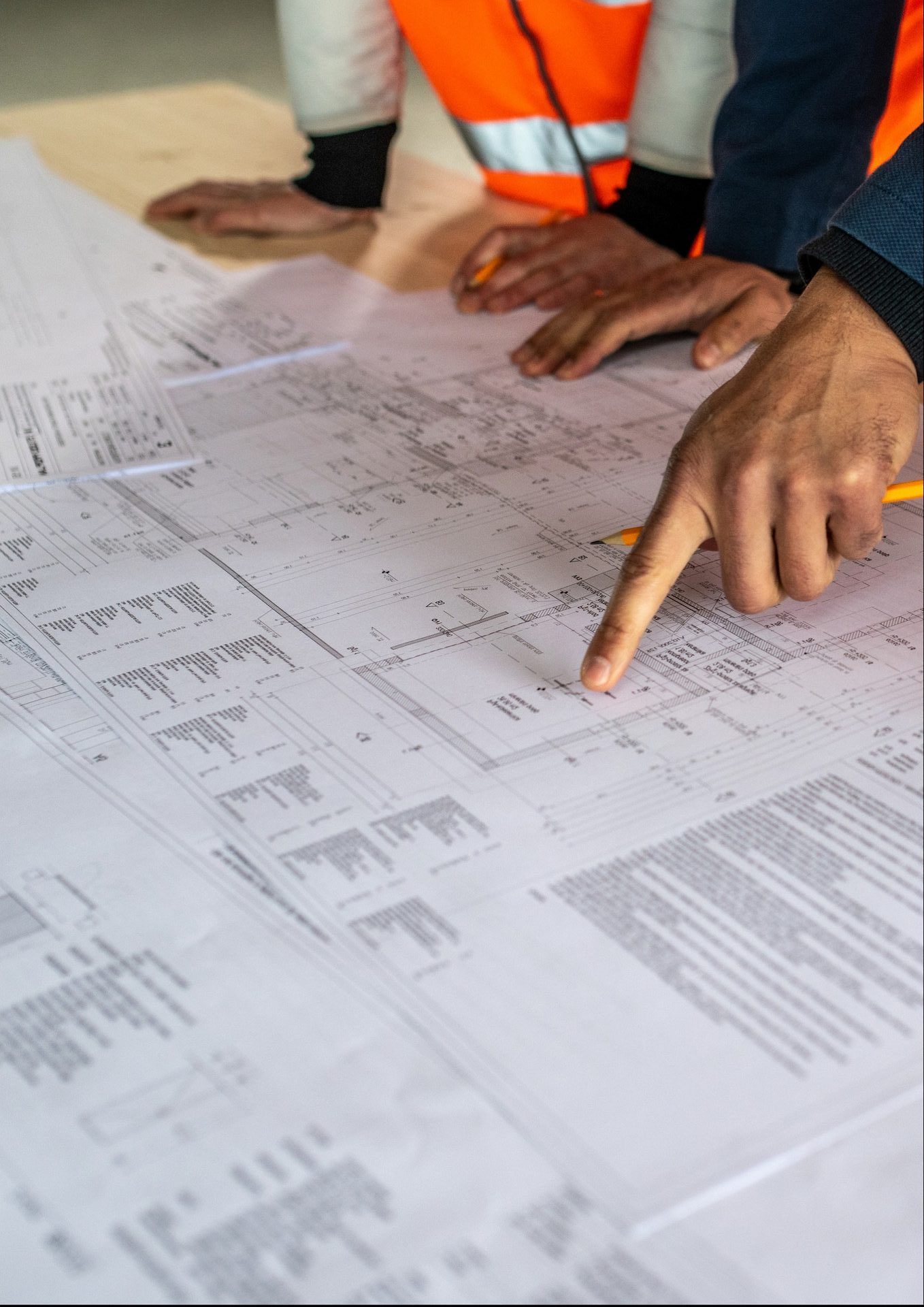 Engineers coordinating over construction plans